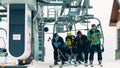 BIALKA TATRZANSKA, POLAND - FEBRUARY 4, 2018. People leaving alpine ski lift or chairlift at the top station on the Royalty Free Stock Photo