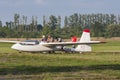 Bialystok, Poland, July 24, 2016: Pilots tow glider after landing Royalty Free Stock Photo