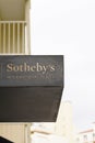Sotheby`s international realty estate sign text and logo in office building agency