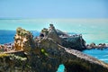 Biarritz city and view of its the famous landmark Rocher de la Vierge, a statue of Virgin Mary on the rock. Seascape. France Royalty Free Stock Photo