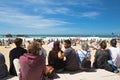 Biarritz, France - May 20, 2017: sandy beach full of people watching and taking photos of surfers isa world surfing games competit