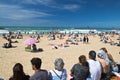Biarritz, France - May 20, 2017: sandy beach full of people watching and taking photos of surfers isa world surfing games competit