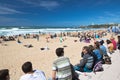 Biarritz, France - May 20, 2017: sandy beach full of people watching and taking photos of surfers isa world surfing games competit