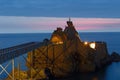 Biarritz, France, Rock of the Virgin -Rocher de la Vierge in French on dramatical sunset over Atlantic ocean Royalty Free Stock Photo