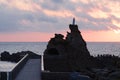 Biarritz, France, Rock of the Virgin -Rocher de la Vierge in French on dramatical sunset over Atlantic ocean Royalty Free Stock Photo