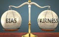 Bias and fairness staying in balance - pictured as a metal scale with weights and labels bias and fairness to symbolize balance Royalty Free Stock Photo