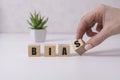 Bias - word from wooden blocks with letters, personal opinions prejudice bias concept, white background