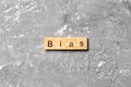 BIAS word written on wood block. BIAS text on cement table for your desing, concept Royalty Free Stock Photo