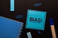 Bias! write on sticky notes isolated on office desk