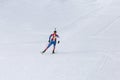 Biathlon racing, biathlete skiing with rifle