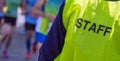 Bib staff service working during a marathon Royalty Free Stock Photo