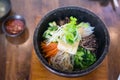 Bibimbap in a heated stone bowl korean style food Royalty Free Stock Photo