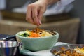 Bibimbap, Traditional Korean cuisine bibimbap, Chef preparing Korean food, chef cooking in kitchen Royalty Free Stock Photo