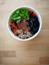 Bibimbap, traditional Korean dish in a take away box, rice with vegetables and beef. Royalty Free Stock Photo