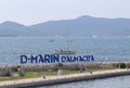 Bibinie, D-Marina, Croatia - sept 9 2018: Logo at the etnrance in mediterranean marina near Sukosan town. The sailing boat