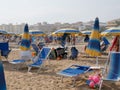 BIBION, ITALY - AUGUST 21, 2019: beach with umbrellas and sunbeds Royalty Free Stock Photo