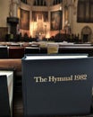 Bible Book Inside the Church Pew and Rows of Bench Seating Religious Place of Worship and Praying Royalty Free Stock Photo