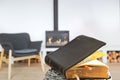 Bible book with pencil, on the background of the living room with a fireplace. Reading a book in a cozy environment