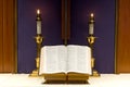 Bible and candles on altar Royalty Free Stock Photo