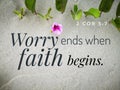 Worry ends when faith begins with bible verse design for Christianity with sandy beach background.