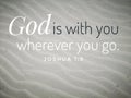 God is with you design for Christianity with sandy beach background. Royalty Free Stock Photo