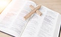 Bible, cross and religion, Christian and worship, faith and God with studying scripture closeup. Jesus Christ, prayer