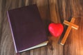 Bible, cross, symbol and red heart Candle light Symbol of supplication and faith The Study of Christ Believing in God, escape, Royalty Free Stock Photo