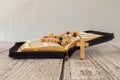 Bible crucifix and beads on a brown wooden table. Beautiful background. Religion concept Royalty Free Stock Photo