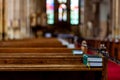 Bible on an empty pew in a church before a service Royalty Free Stock Photo