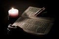 Bible illuminated by candle