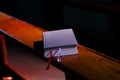 Bible lies on Kneelers in the Church Royalty Free Stock Photo