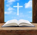 Bible open christian cross light sky view Royalty Free Stock Photo