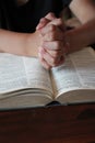 Bible and  pray  hands together background with copy space  table Royalty Free Stock Photo