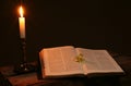 Bible prayer book candle