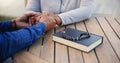 Bible, praying or couple holding hands on table together in a Christian belief with hope or faith. Jesus, zoom or senior Royalty Free Stock Photo