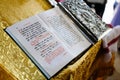 Bible on reading-desk or lectern, sacred lectern in the church decorated with golden friezes and ornaments Royalty Free Stock Photo