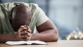 Bible, reading and man praying with book and religion study at home for worship and spiritual support. Faith, christian Royalty Free Stock Photo