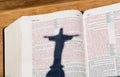 Bible with red letters & shadow of Jesus Christ