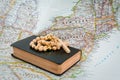 Bible rosary beads on map. Pray for New York Royalty Free Stock Photo