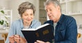 Bible study, reading and senior couple in home with Christian worship, prayer and education in faith. Elderly, people Royalty Free Stock Photo