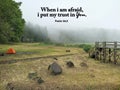 Bible verse quote - When i am afraid, i put my trust in You. Psalm 56:3 On a foggy background over camp area. Christianity