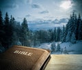 Bible with winter mountain scenics