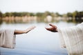 Biblical scene - of a female grabbing the hand of Jesus Chris with a blurred background Royalty Free Stock Photo