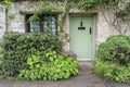 Traditional cotswold stone cottages built of distinctive yellow limestone in the famous Arlington Row, Bibury Gloucestershire UK