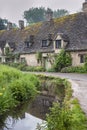 Traditional cotswold stone cottages built of distinctive yellow limestone in the famous Arlington Row, Bibury Gloucestershire UK