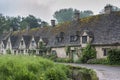 Traditional cotswold stone cottages built of distinctive yellow limestone in the famous Arlington Row, Bibury Gloucestershire UK Royalty Free Stock Photo