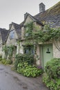 Traditional cotswold stone cottages built of distinctive yellow limestone in the famous Arlington Row, Bibury Gloucestershire UK