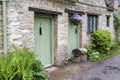 Traditional cotswold stone cottages built of distinctive yellow limestone in the famous Arlington Row, Bibury Gloucestershire UK