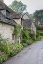 Traditional cotswold stone cottages built of distinctive yellow limestone in the famous Arlington Row, Bibury Gloucestershire UK Royalty Free Stock Photo