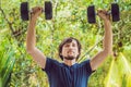 Bicep curl - weight training fitness man outside working out arms lifting dumbbells doing biceps curls. Male sports Royalty Free Stock Photo